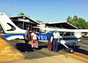 Translators Djawut (left) & Yurranydjil (right) boarding the plane with consultant Chuck Grimes and pilot Randall Pearson at Darwin for the 2 1/2 flight to Elcho Island and the town of Galiwinku