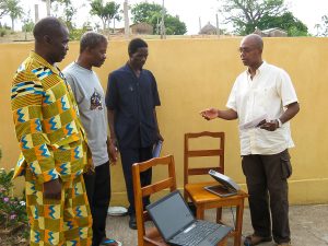 Bible translators in Togo learn about a BGAN, which is used for satellite Internet.